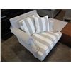 Image 1 : ASHLEY FLOOR MODEL CONTEMPORARY GREY AND WHITE STRIPED ARM CHAIR - STAIN ON CORNER OF SEAT CUSHION