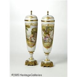 A PAIR OF FRENCH METAL-MOUNTED CAPPED SÈVRES URNS