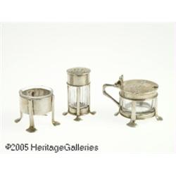 AN ENGLISH SILVER AND GLASS CONDIMENT SET RHutton