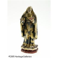A WOODEN GILT AND POLYCHROME DECORATED SANTOS FIG