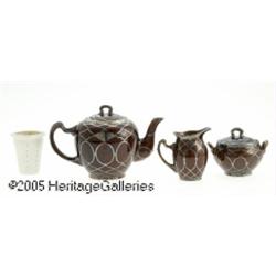 AN AMERICAN PORCELAIN AND SILVER OVERLAY TEA SET 