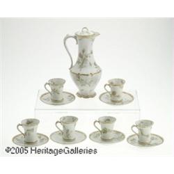 A FOURTEEN-PIECE FRENCH PORCELAIN CHOCOLATE SET R