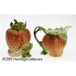 A GERMAN CERAMIC 'STRAWBERRY' CREAMER AND SUGAR R