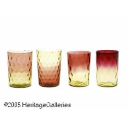 A COLLECTION OF FOUR AMERICAN AMBERINA GLASS TUMB