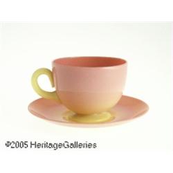 AN AMERICAN GLOSSY BURMESE GLASS CUP AND SAUCER R