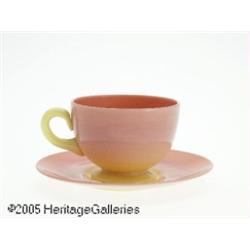 AN AMERICAN GLOSSY BURMESE GLASS CUP AND SAUCER R