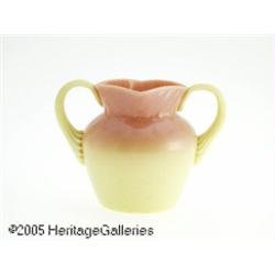 AN AMERICAN GLOSSY BURMESE TWO-HANDLED GLASS VASE