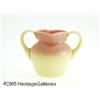 Image 1 : AN AMERICAN GLOSSY BURMESE TWO-HANDLED GLASS VASE
