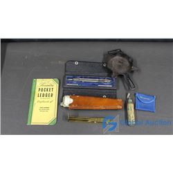 Cast Iron Ashtray, Pocket Ledger, Bottle Opener, and Measuring Tools