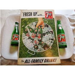 LOT INCLUDING 2 7-UP BOTTLES AND A 1965 7-UP CARDBOARD ADVERTISMENT (12X18)
