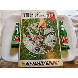 LOT INCLUDING 2 7-UP BOTTLES AND A 1965 7-UP CARDBOARD ADVERTISMENT (12X18)