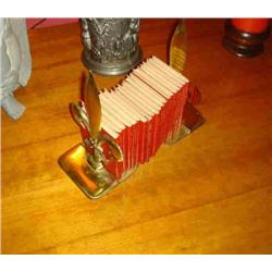 FLEUR-DE-LIS BOOKENDS & SMALL RED BOOKS