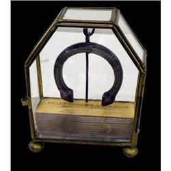 Eilley Orrum's silver medallion in glass case