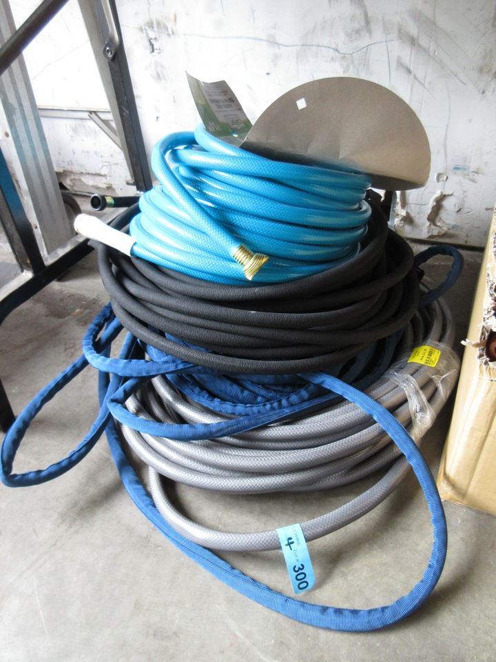 Pile of 4 Garden Hoses Store Returns