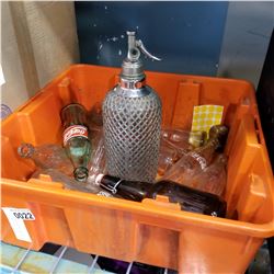 ORANGE TIN OF GLASS COKE BOTTLES AND SELTZER BOTTLE