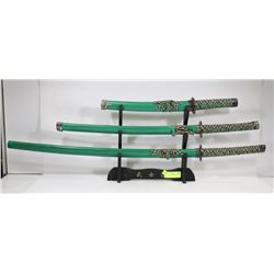 SET OF 3 JAPANESE SWORDS ON STAND
