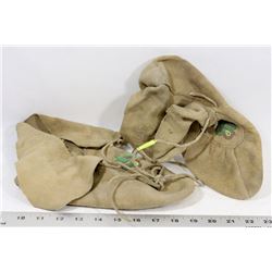 A PAIR OF VINTAGE INDIGENOUS BEADED MOCCASINS