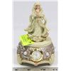 Image 1 : MUSICAL TABLE CLOCK WITH STATUE OF PRAYING FIGURE