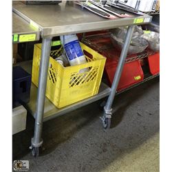 STAINLESS STEEL TABLE W/ BACKSPLASH ON CASTORS