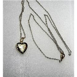 17)  GOLD TONE ETCHED HEART LOCKET