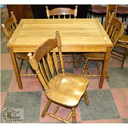 OAK TABLE WITH EXTENSION LEAVES AND FOUR CHAIRS