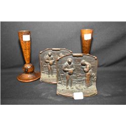 Pair of heavy cast bookend featuring a rural scene with a man and a women praying and a pair of turn