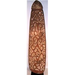 A FINE AND OLD ASMAT SHIELD, of classic ovoid for
