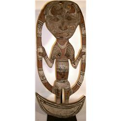 A OLD SEPIK FOOD HOOK, of wood, the openwork fram