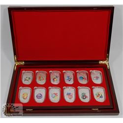 CHINESE TOKENS IN CASE, 12 TOTAL