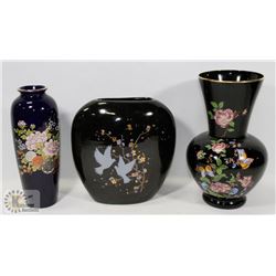 LARGE FLAT WITH ASIAN CASES WITH GOLD TRIM.