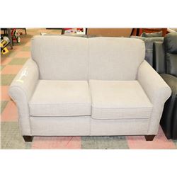 SANDY GREY FABRIC LOVESEAT.