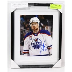 FRAMED ADAM LARSSON AUTOGRAPHED PHOTO.