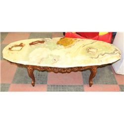 DAMAGED CARVED STYLE NATURAL STONE COFFEE TABLE
