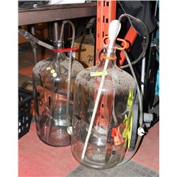 PAIR OF GLASS WINE MAKING BOTTLES.