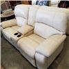 Image 1 : ASHLEY FLOOR MODEL CREAM GENUINE LEATHER POWER RECLINING AND ROCKING LOVESEAT WITH CONSOLE RETAIL $2