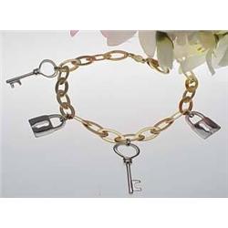 14kt two-tone bracelet with lock and key charms 1
