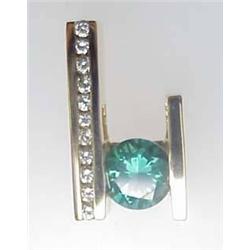 Lady's 14kt yellow gold designer pendant with gre