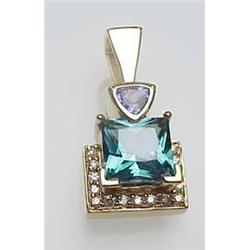Lady's 14kt yellow gold designer pendant with gre