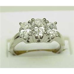 Lady's three stone diamond ring 1.25Ctw oval diam