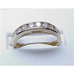 Lady's 14kt yellow gold channel set diamond band 