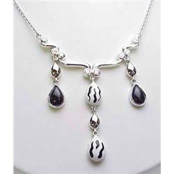 Sterling silver black and white enameled pendant