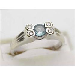 Lady's 14kt white gold ring with a 3.5mm round al