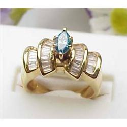 Lady's 14kt yellow ring with marquise cut blue di