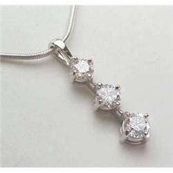 14kt white gold three stone diamond pendant .75Ct