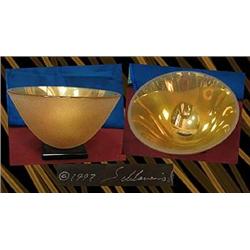 Gold art glass fruit bowl .  Bowl has a textured 