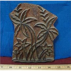 Vintage wood block stamp with a palm tree design.