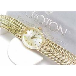 Lady's 14k yellow gold Croton quartz watch with b