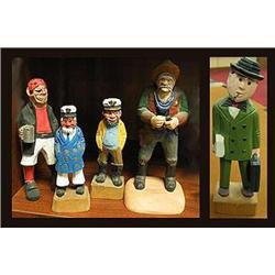 Collection of five hand carved wooden people.  Th