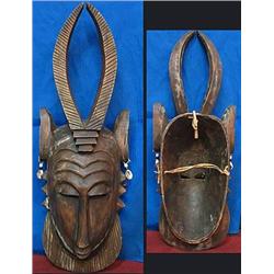 Carved wood African mask.  20" tall