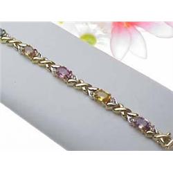 Multi-colored sapphire 5.23Ctw  and diamond .13Ct